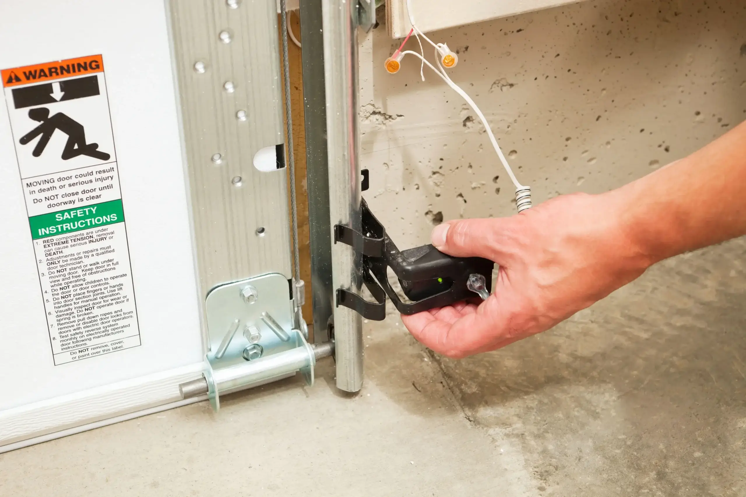 Garage door safety system inspection by a professional technician