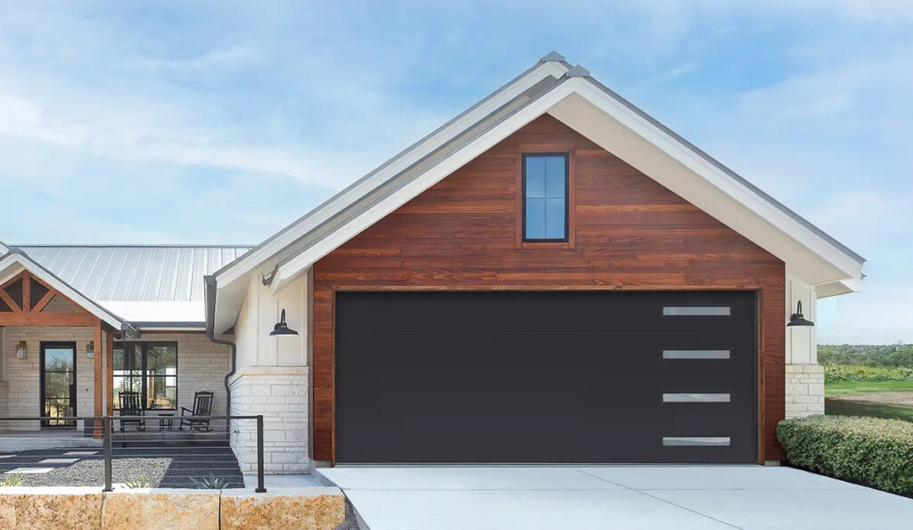 Modern home with dark horizontal garage door