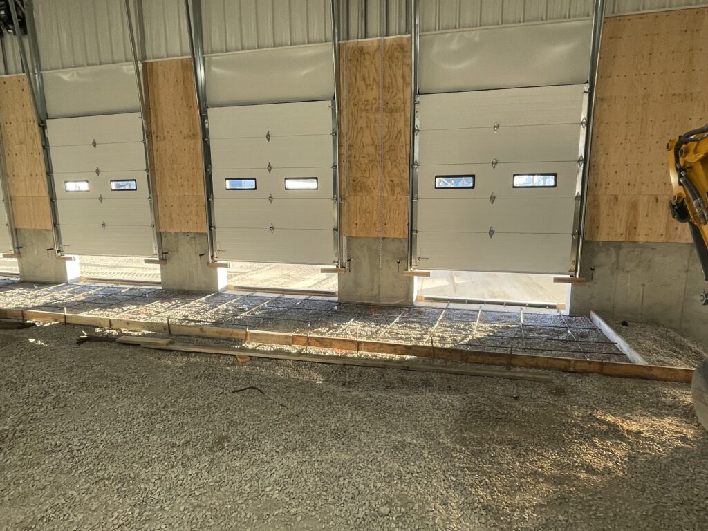 Commercial overhead garage door maximizing usable ceiling space