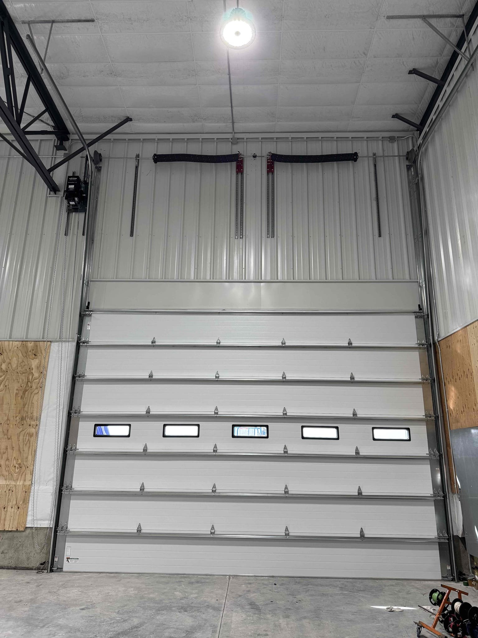 Interior commercial overhead door installation for Driscoll Potatoes