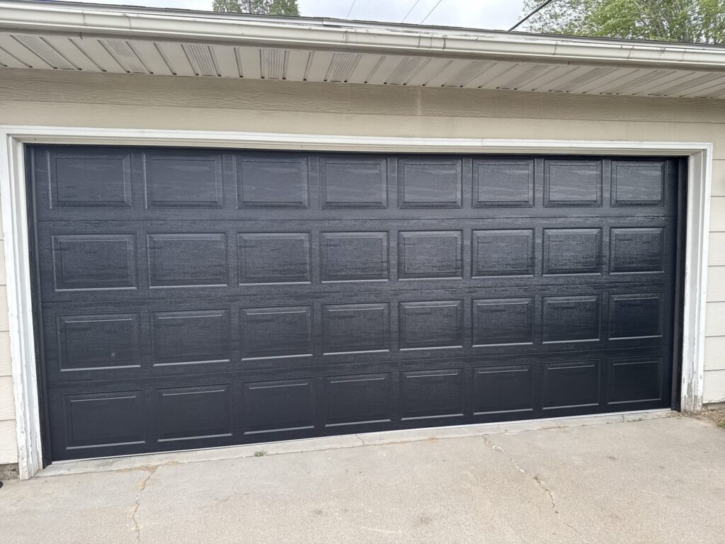 Custom home garage door installation by Quality Overhead Door