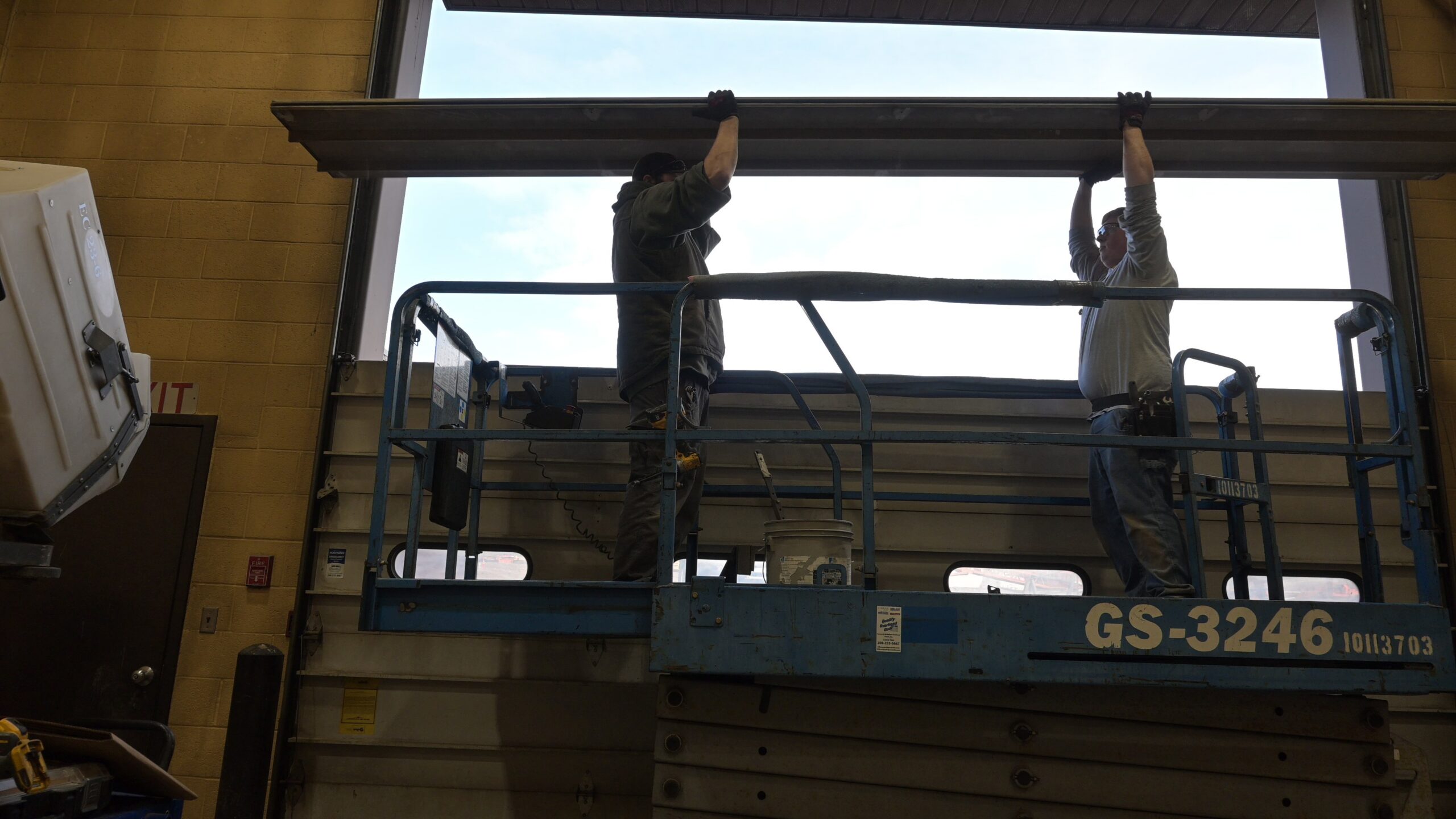 Quality Overhead Door service team working on a garage door project