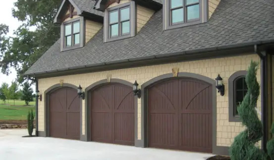 Wood composite garage door installation by Quality Overhead Door